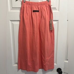 NWT FOG Essentials Fear of God Women's
Jersey Long Skirt Coral Small BRAND NEW